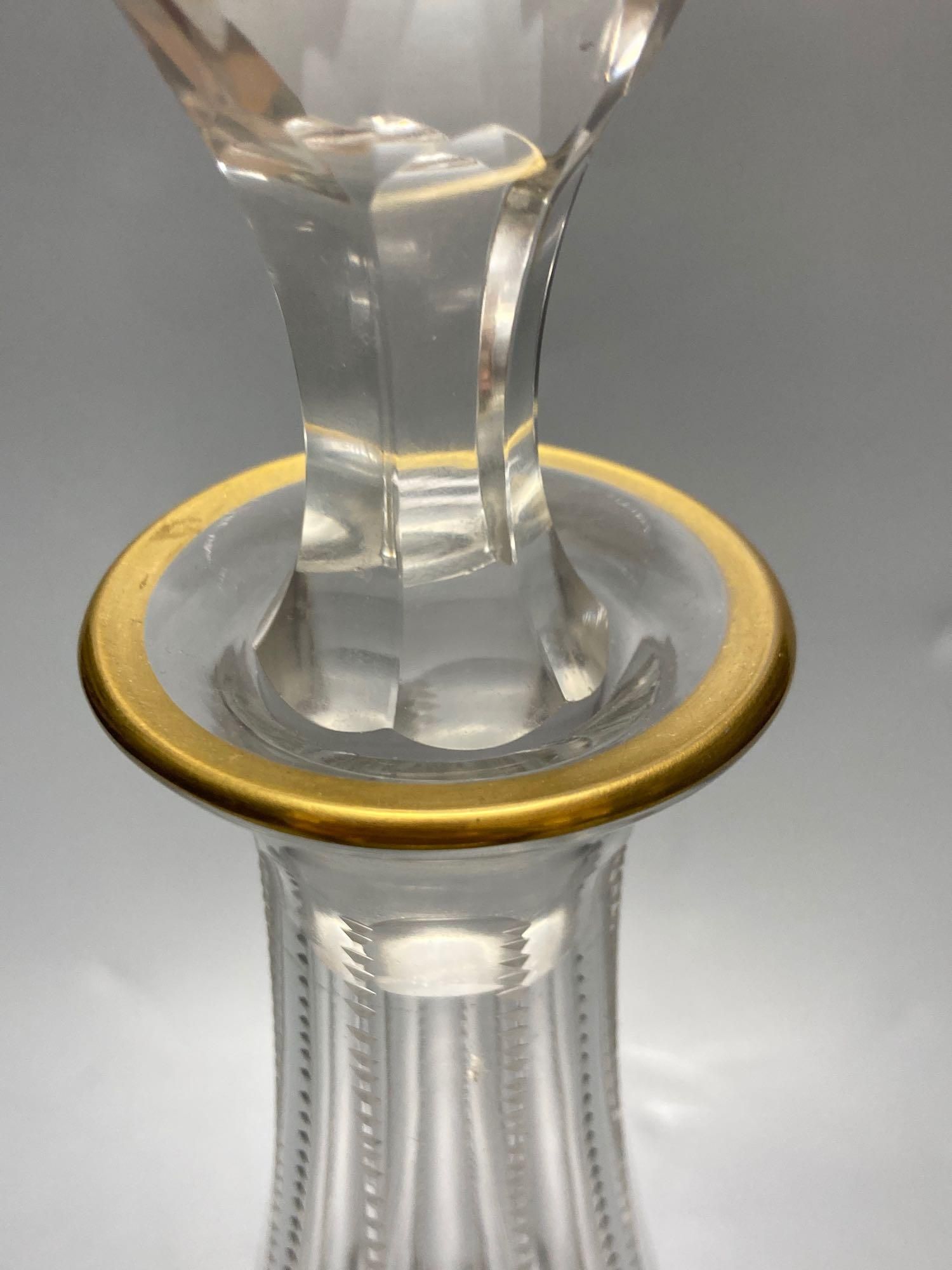 A pair of tall Bohemian cut glass decanters with faceted stoppers, unsigned, 35cm